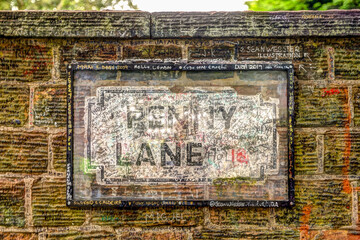 The street sign for Penny Lane in Liverpool UK signed by Paul McCartney