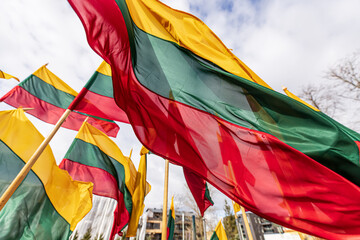 Lithuanian flags waving in a wind  - obrazy, fototapety, plakaty