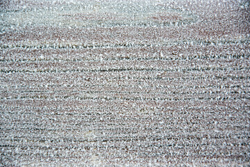 Brown outdoor wooden boards frozen from frost