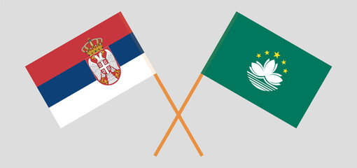 Crossed flags of Serbia and Macau. Official colors. Correct proportion