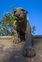 Stone lioness sculpture on the "animal wall"  near Cardiff Castle, Wales.