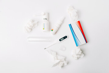 Photo of pills flu treatment, nasal spray and thermometer