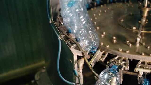 Beverage factory interior. Conveyor with plastic bottles