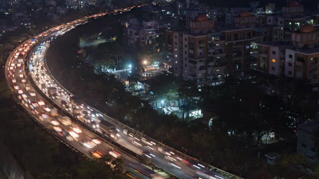 Aerial Cityscape View and Time lapse of Busy Traffic on Pune Mumbai Curvy National Highway during night
