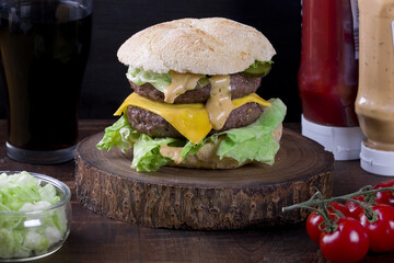 double cheeseburger on a wooden board
