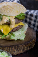 double cheeseburger on a wooden board