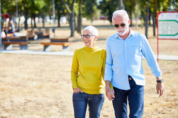 senior couple happy elderly love together cheerful smiling portrait holding hands woman retirement man - Powered by Adobe