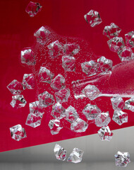 Bottled water spilled on a glass table. Pieces of ice in water and a neck in a bottle on a red background