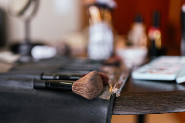 Makeup brush case on a wooden table