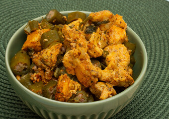 delicious brazilian meal in a  bowl  full of  piece of chicken and okra