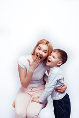 young modern blond curly mother with cute son together happy smiling family posing cheerful on white background, lifestyle people concept, sister and brother friends