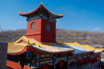 Anchient china temple at winter spring season  with icicles on roof and melting with title...
