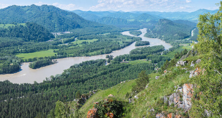 View of the Katun river valley, Altai. Sunny day in summer. Travel and vacation in the mountains.