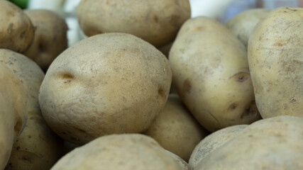 Group of Raw Fresh Potatoes in the Market