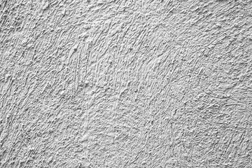 The walls of the cement building are painted in white with a rough surface texture and background seamless