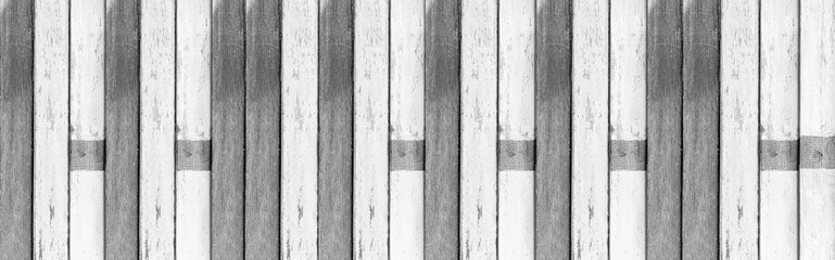 Panorama of Vintage old white and black wooden fence texture and background seamless