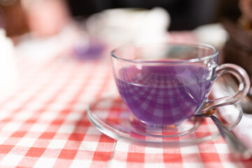 Cup tea of viola flowers, cinnamon and ginger. selective focus