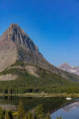 Tour boat on Swiftcurrent Lake in Glacier National Park, Montana, USA