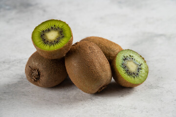 Fresh slices of kiwi on a white background