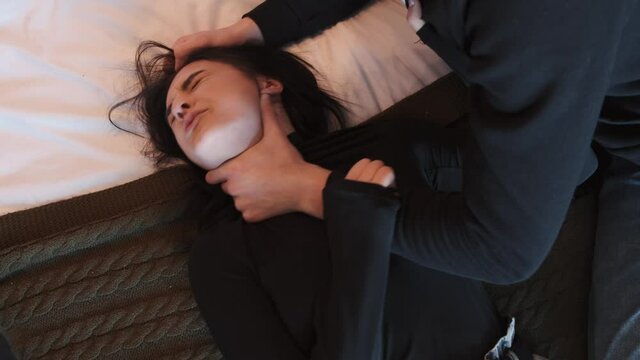 Angry husband beating and choking scared wife at home