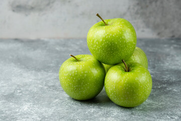 Bunch of ripe apples on marble background