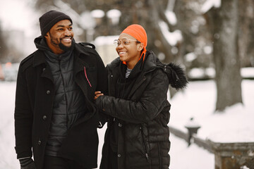 Fototapeta na wymiar African american couple in a winter city