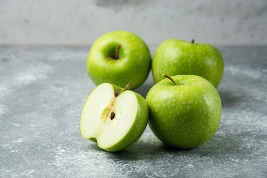 Bunch of green apples on marble background