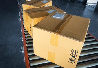 Cardboard boxes sorting on roller conveyor at the warehouse. Shipment boxes. Store warehousing....