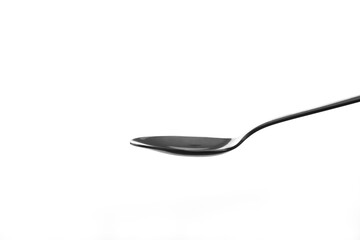 Metal spoon on white background.