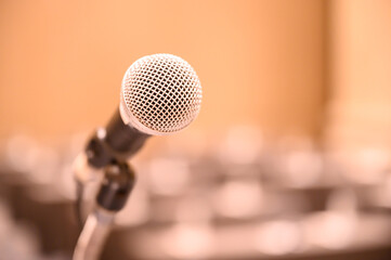 Microphone over the blurred business people forum Meeting Conference Training Learning Coaching Concept, Blurred background.