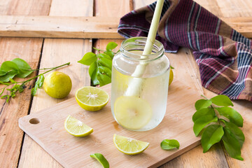 herbal healthy drinks cold  lemon for health care with peppermint leaf and lemon slice arrangement...