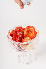 Fresh strawberry fruit salad on pure white background