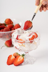 Fresh strawberry fruit salad on pure white background