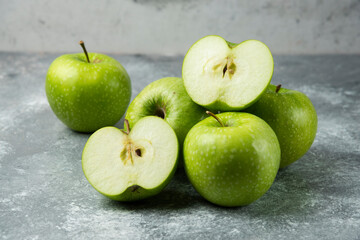 Bunch of green apples on marble background