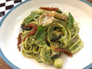 Italian food pesto pasta with sundried tomato