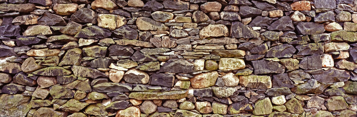 Dry stone wall in the Lake District showing rocks with colour and texture