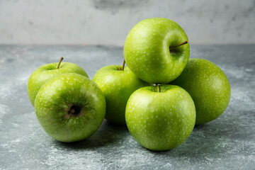 Bunch of fresh apples on marble background