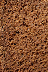 Black rye bread as background.