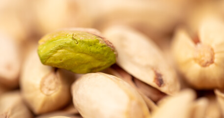 Close-up of fresh pistachio nuts as background.