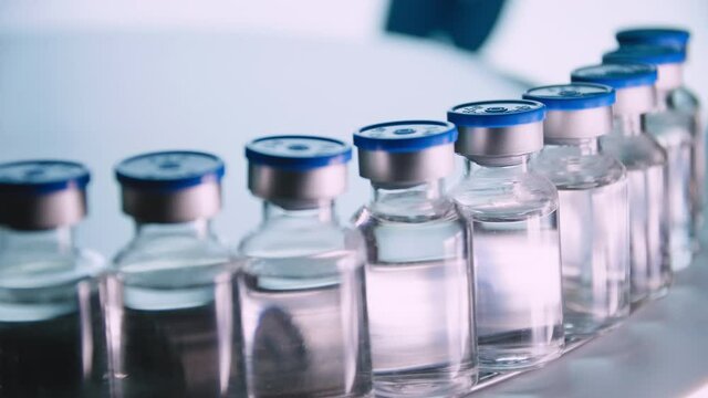 Group of Vaccine bottles. Medicine in ampoules. Glass vials for liquid samples in laboratory.