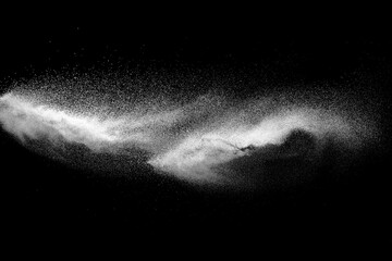 Fototapeta na wymiar White dust particle splash on black background.