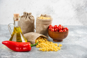 Pastas in rustic bags served with cherry tomatoes, chilies and olive oil