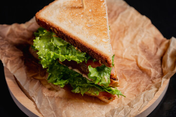 Breakfast sandwich on a black background