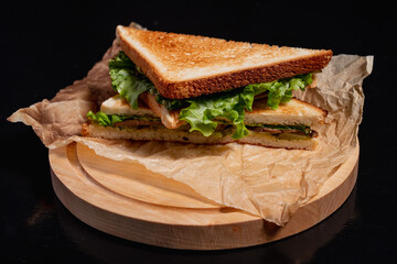 Breakfast sandwich on a black background