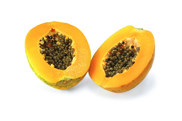 Two halfs papaya with black grains isolated on white