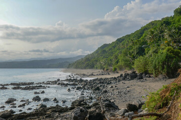 Fototapeta na wymiar Landscape view of rocky tropical coastline on the Sawu sea near Sikka village, East Flores island, East Nusa Tenggara, Indonesia