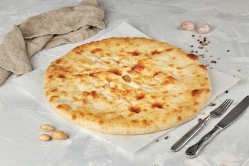 Ossetian pie with cabbage on light background