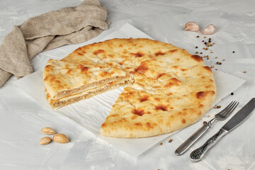 Ossetian pie with cabbage on light background