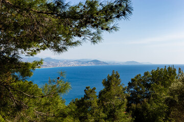 Fototapeta na wymiar Mediterranean coastline. Blue sea, hills and clear sky.