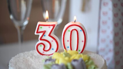 Birthday candle as number thirty 30 on top of sweet cake on the table, 30th birthday - Powered by Adobe